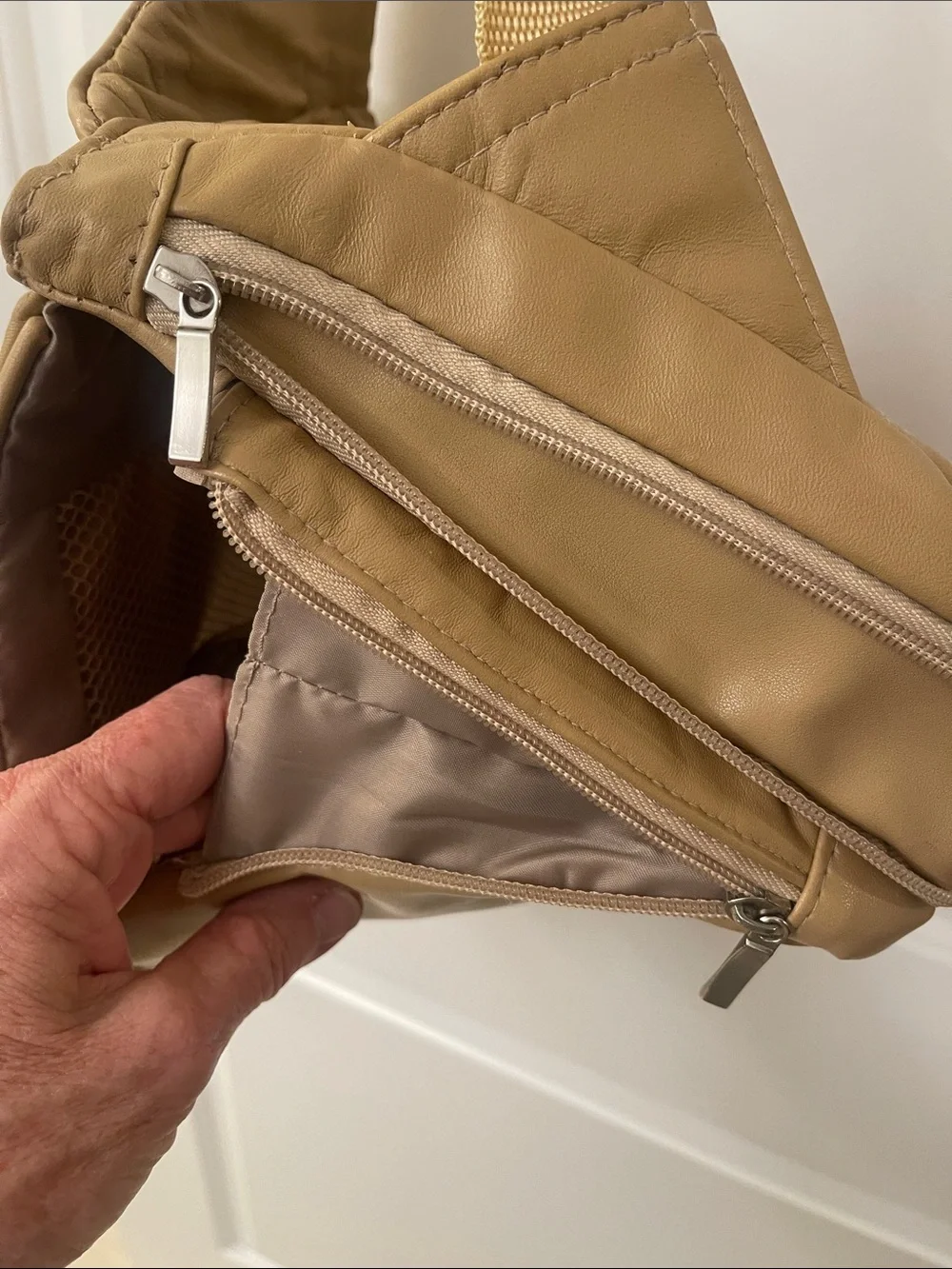 Buxton tan crossbody sling backpack
